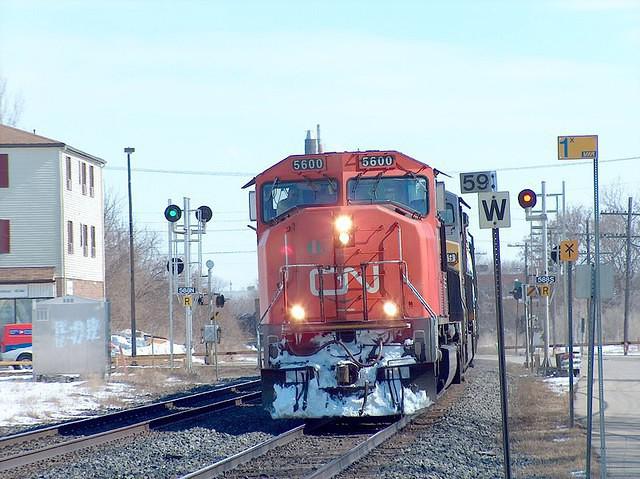 CN 5600 leads a CSX unit through Ingersoll Ontario 3-14-05