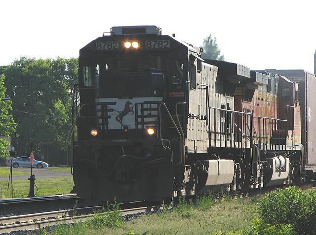 NS 8782 leads BNSF 5445 on 327 Ingersoll Ontraio 6-20-06