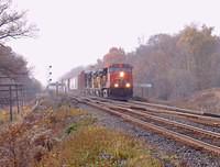 CN 2548 leads 2 UP units and a patched DRGW 8632 through Lihou Dundas sub mile 61.44 10-27-04
