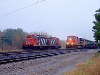 CN 2572 leads Sante Fe 6868, BNSF 7160 and and IC unit eb through Ingersoll 10-20-04