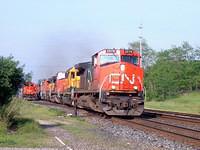 Train 394 with CN 2579 leading lots of power through Ingersoll 6/9/04