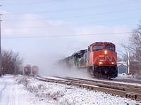 CN 2658 leads a BNSF unit, NS 7051 GP 50 and another CN unit eb through Ingersoll Ontario 1-14-05