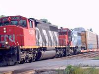 A pair of SD-40's looking quite different CN 5279 & GT 5912 wb through Ingersoll 7/20/04