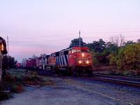 CN 5523 leads 2 BNSF units in different paint through Ingersoll Ontario 9-26-04