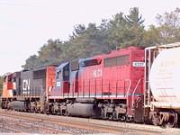 CN 5777 leads HLCX 6331 on #399 Ingersoll Ontario 10-8-04