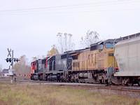 CN 5700 leads IC 6808 and UP 9499 on a wb through Ingersoll 10-21-04