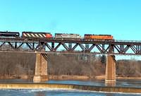 BNSF 4749, RLCX 8512 and CN 5544 on 394 leaving Paris and crossing the Grand River 1-15-06