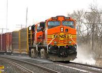 BNSF 5155 leads 7797 with swoosh paint on 391 Ingersoll Ontario 4-6-07