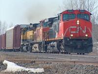 CN 2563 leads BNSF 4431 and ICE 363 Iowa, Chicago and Eastern (formerly known as IMRL)on 394 Ingersoll Ontario 5-6-05
