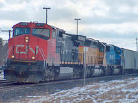 CN 2573 leads UP 2796 and Conrail 6783 eb through Ingersoll Ontario 2-12-05
