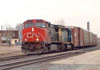CN 2578 leads CSX 8429 SD40-2 on 385 through Ingersoll Ontario 3-23-06