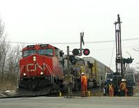 CN 2614 crawls past the boys as it leaves Ingersoll 3-28-08