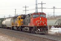 CN 2657 leads Santa Fe 6466 wb through Ingersoll Ontario 3-8-06