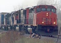 CN 5353 leads another CN unit and MRL 307 and CN/WC 6948 eb through Woodstock Ontario 4-20-05