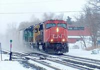 CN 5624 leads Santa Fe 6714 and BNSF 7044 on 410 through Ingersoll Ontario 3-2-05