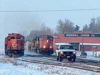 CN 5635 leads 410 through Ingersoll with track inpsection foreman and the Sperry car behind 4122 being covered in snow 2-12-05