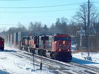 CN 5703 leads another CN unit and 2 BNSF units on 148. Ingersoll Ontario 1-27-05