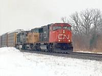 CN 5744 leads UP 9520 and GTW 5952 on 392 through Beachville Ontario 12-23-05