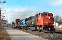 CN 5779 leads Conrail 4803 and GCFX 6077 on 148 through Ingersoll Ontario 1-22-06