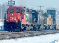 CN 6024 leads IC & UP units on 149 through Ingersoll Ontario 3-4-05