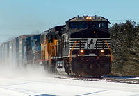 NS 9811 leads 392 with HLCX 5994, NS/Conrail 8444, 93 cars through Ingersoll Ontario McKeand St 3-3-06