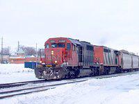 CN 5366 heads through Ingersoll westbound. Note the side panels are open and you can see the interior light.
Mile 59.0 Dundas Sub 1/20/04