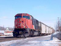 CN 5607  SD70I leads a long freight solo westbound through Ingersoll 2/16/04
