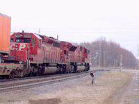CP 5655 SD40 hangs on as 9137 SD90MAC blows through Zorra, notice the mismatched number boards 4/1/04.
This unit was built by EMD in LaGrange due to the heavy load at GMD