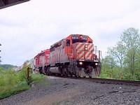 CP 5973 and SOO 6616 lead a long container train westbound through Woodstock 5/26/04