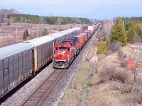 CP 6061 leads a westbound through Coakley, Galt Sub, past a waiting eastbound 4/3/04