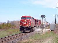 CP 9544 leads 8605 past Mile 97.4 Galt sub as Expressway kicks up dust as it blasts westbound. 5/7/04
