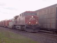 CP 9751 eastbound sliding past 8543 sitting in the siding 4/27/04