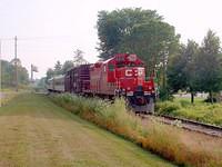 CP 8218 leads the Tech train wb on the St Thomas sub, Ingersoll Mile 9.8 7/21/04