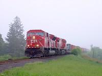 CP 9141 & 8546 emerge from the fog westbound Thamesford Ontario 5/243/04
