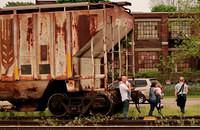 Taken at Woodstock Ont. Photographer posing people on railcars in the Woodstock CP yard.