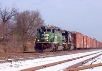 BNSF 6825 SD40-2 leads NS  6693 SD60 on 327 Ingersoll Ontario 12-21-04