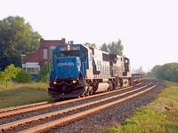 CONRAIL 6716 leads NS 9446 on 327 through Ingersoll Ontario 8-9-04