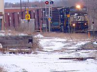 NS 8334 leads 327 through Ingersoll 3/13/04