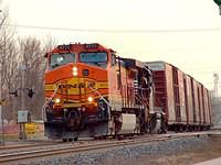 BNSF 4770 leads NS 327 as it roars through ingersoll Ontario with 12 cars. 3-31-06