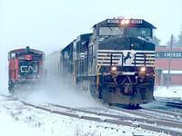 NS 9011 C40-9W leads 6694 SD60 on 328 through Ingersoll Ontario past CN 1423 GMD1u 3-11-05 Time 08:47