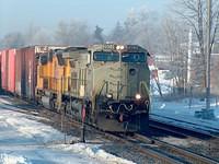 NS 9904 still in grey primer leads UP 4783 on 328 through Ingersoll Ontario Time 08:55 2-1-05