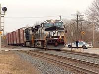 NS 9908 leads a huge train :-) on 327 through Ingersoll after flagging the crossing for a defective gate. 4-1-06