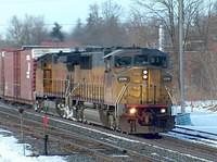 UP 2376 leads 328 through Ingersoll Ontario 36 boxcars, 12 hoppers Time: 09:10 2-24-05