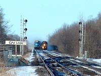 NS 328 with Conrail 6732 waits as VIA 70 prepares to crossover in front of it 2-26-05